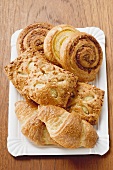 Assorted Danish pastries on a paper plate