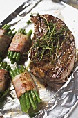 Grilled beef steak with bacon-wrapped beans