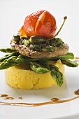 Veal escalope with herb crust on polenta and asparagus