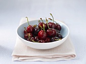 Fresh cherries in a small bowl