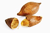 Two salak fruits, one opened