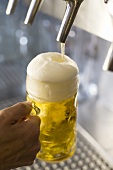 Pouring a litre of draught beer