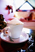 A cup of cappuccino with milk froth