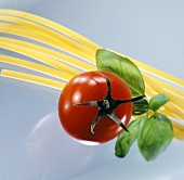 Spaghetti with a tomato and basil