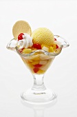 Fruit cocktail with vanilla ice cream and cream