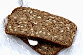 Two slices of sunflower bread with knife