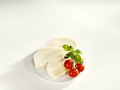 Three slices of mozzarella on a plate