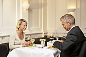 Man and woman eating together in a restaurant