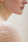 Young woman with salt on her skin