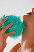 Woman exfoliating with a cloth
