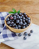 Fresh blueberries in a wicker bowl
