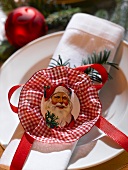Place-setting with napkin and Father Christmas
