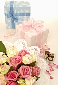 Two gifts, bouquet of flowers and chocolates