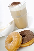 Milky coffee with doughnuts