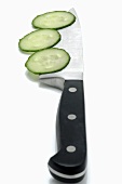 Slices of cucumber and kitchen knife