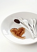 Chocolate heart painted on plate