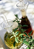 Herb oil and vinegar in carafes
