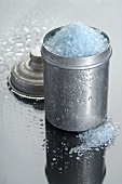 Blue bath salts in metal container