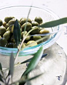 Green olives in glass dish