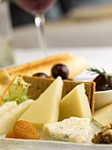 Various cheeses with fruit