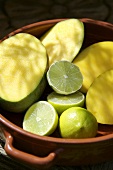 Halved limes and mangos with slices removed