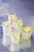 Five glasses of lemonade with straws