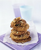 Chocolate chip cookies, stacked on paper