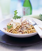 Spaghetti with ham and mushroom sauce and chicken breast