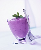 Berry yoghurt with mint in a glass