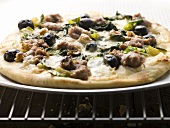 Pizza with mince, olives, spinach and cheese