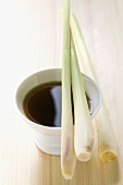 Lemon grass on small bowl of soy sauce