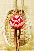 Radish flower on chopsticks