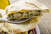 Spinach and ricotta pie (one piece on spatula)