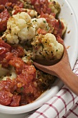Cauliflower and tomato bake (detail with wooden spoon)