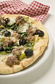 Pizza with tuna, chard and olives