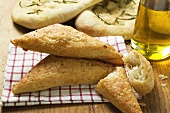 Triangular puff pastry pasties, focaccia and olive oil