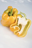 Yellow peppers, whole and halved