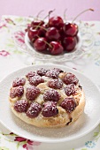 Cherry tart with icing sugar