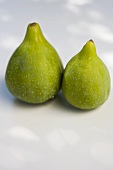 Two fresh green figs