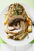 Roast turkey roll with root vegetables and herbs