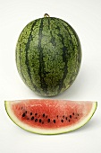 Whole watermelon and a slice of watermelon
