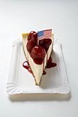 Piece of cheesecake with cherry sauce (USA)