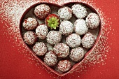 Sugared strawberries in heart-shaped dish
