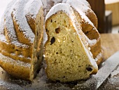 Gugelhupf with icing sugar, partly sliced