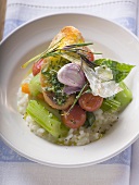 Risotto with vegetables, crostini, pesto and rosemary
