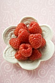 Raspberries in small white dish (overhead view)