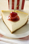 Piece of cheesecake with cherry