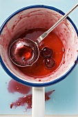 Remains of cherry jam in a pan