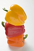 Yellow, orange and red peppers with drops of water