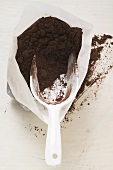 Cocoa powder in bag with scoop